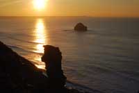 Sunset over Lanterdan Quarry at Trebarwith Strand in North Cornwall