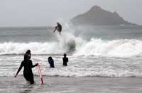 Surfing at Lundy Bay in North Cornwall